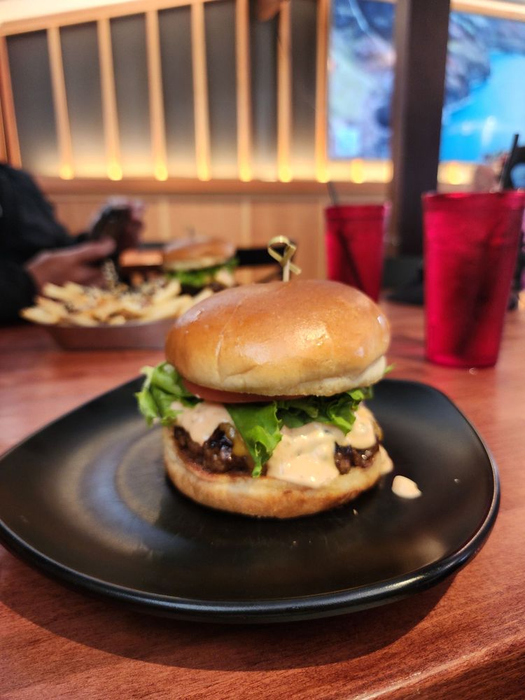 A burger on the counter at Kenji Burger