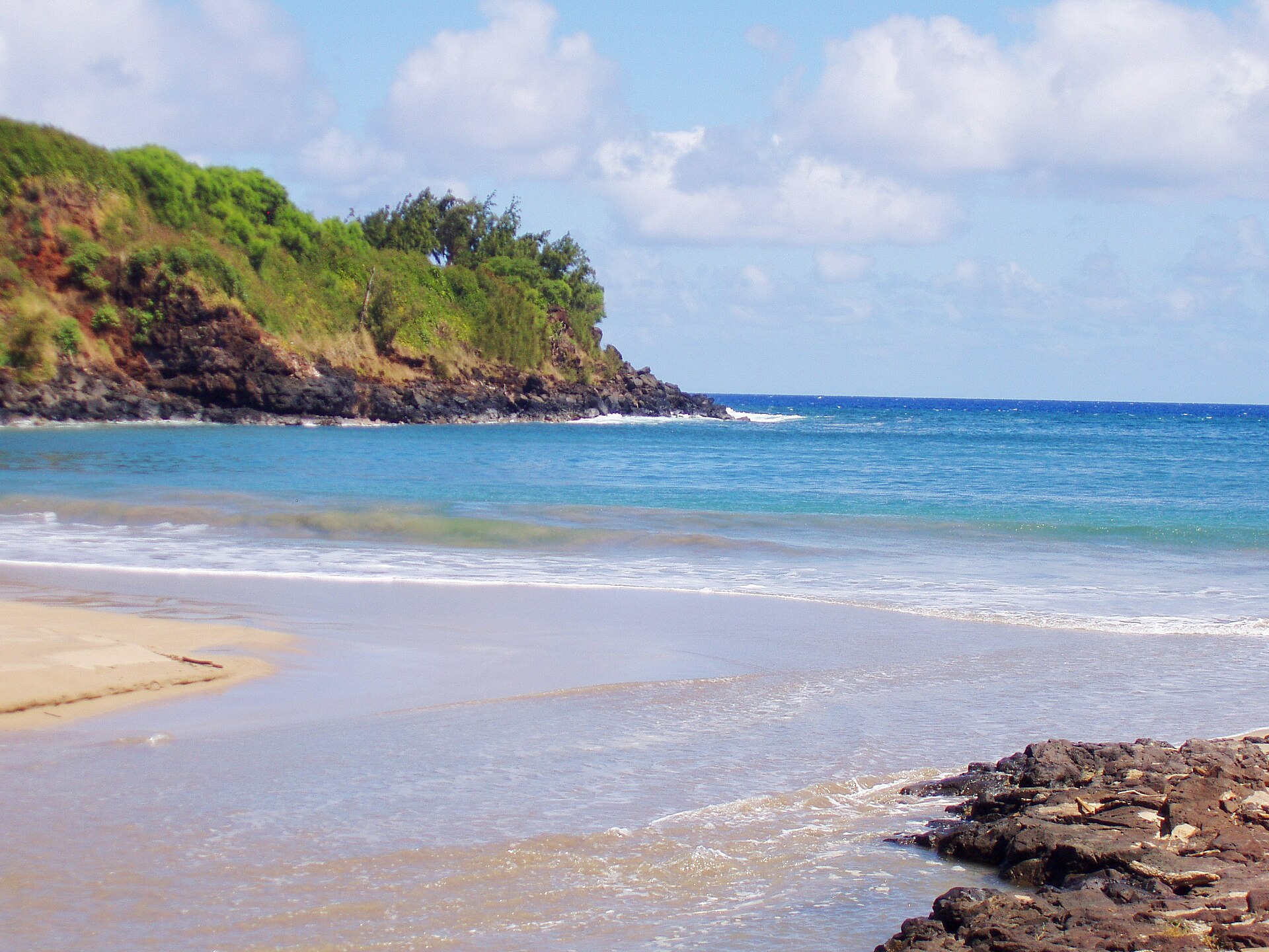 A view down through Allerton Garden toward Lāwa'i Bay on Kaua'i's south shore
