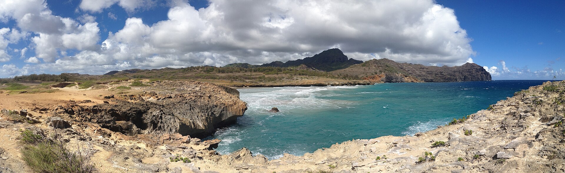The undeveloped dunes and turquoise water of Māhā'ulepū at the eastern end of Kaua'i's south shore